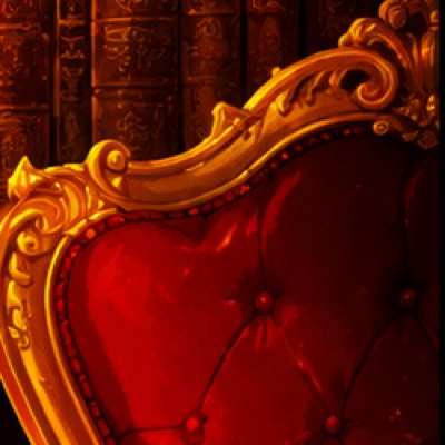 A red velvet armchair in a carved and gilded frame.